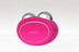 Dispositivo Foreo Bear en color fucsia con cabezales esféricos metálicos para tonificación facial, sobre fondo neutro.